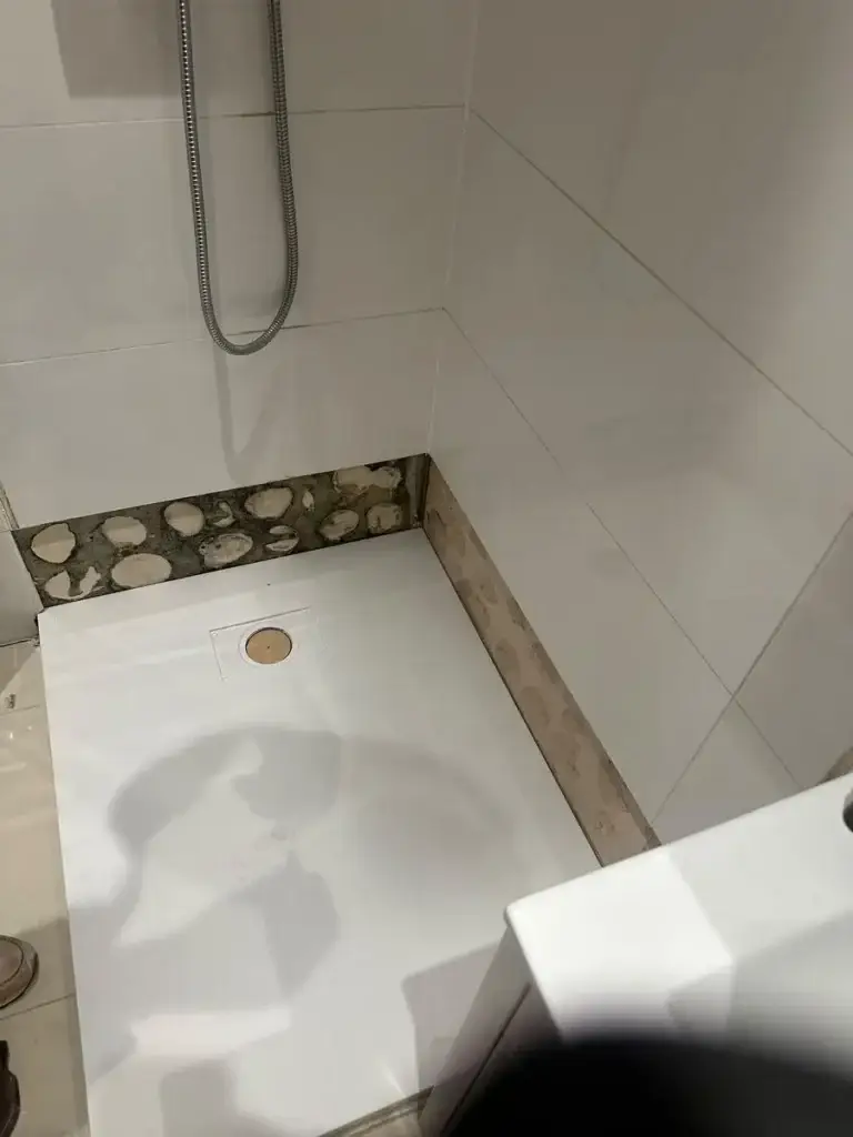 Walk-in shower tray fitted in a bathroom
